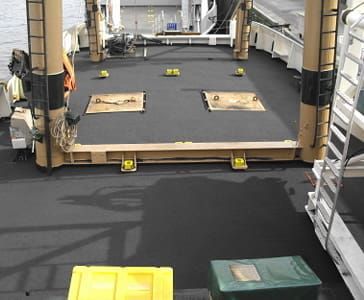 A special floor on a ship in grey with wooden elements